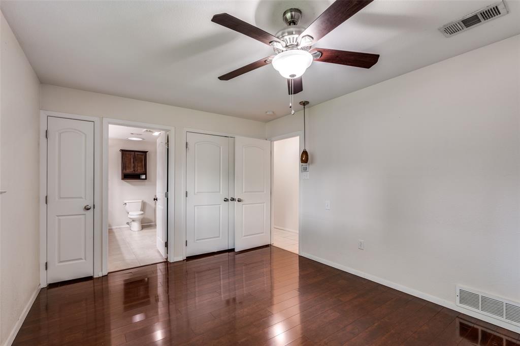 1501 Ridgeview Drive Arlington, TX 76012 - Photo 22 of 32 wooden floor in an empty room with a window