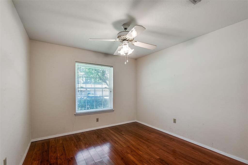 1501 Ridgeview Drive Arlington, TX 76012 - Photo 23 of 32 wooden floor in an empty room with a window
