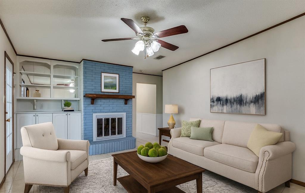 1501 Ridgeview Drive Arlington, TX 76012 - Photo 6 of 32 a living room with furniture a fireplace and a ceiling fan