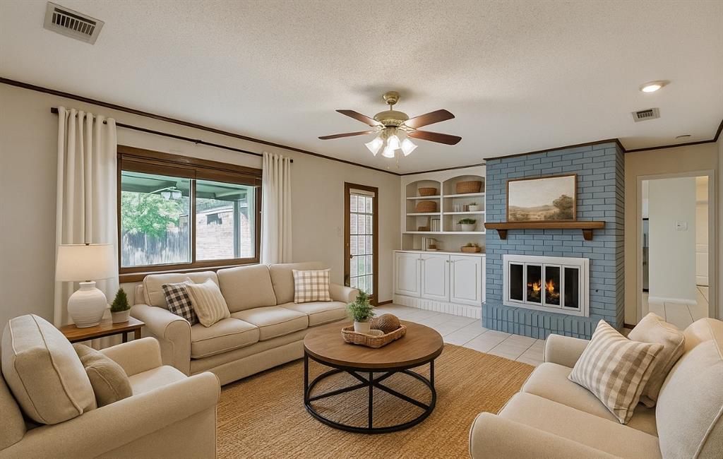 1501 Ridgeview Drive Arlington, TX 76012 - Photo 7 of 32 a living room with furniture a fireplace and a flat screen tv