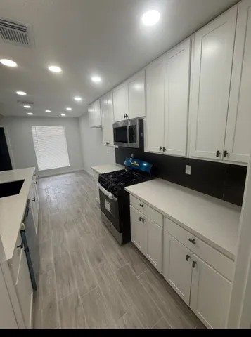 a bathroom with a sink and mirror