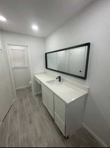 a bathroom with a glass shower door