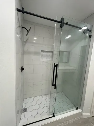 a bathroom with a sink a toilet and bathtub