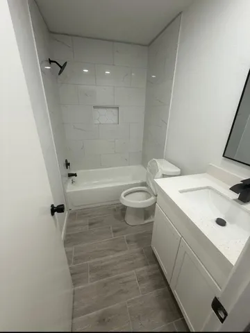 a large kitchen with a lot of counter space and a sink