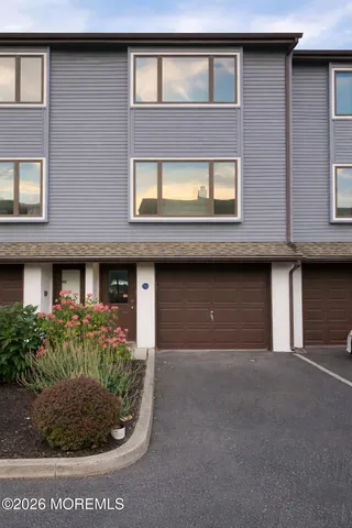a front view of a building with garden