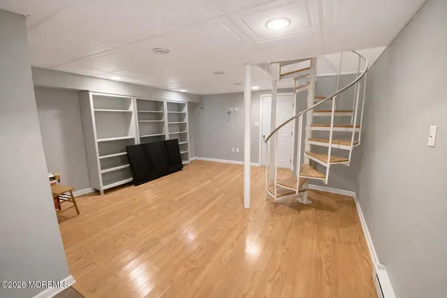 a view of an empty room with a fireplace