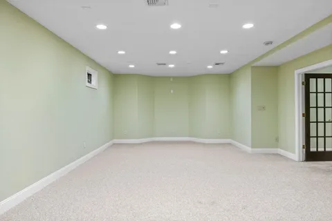 a bedroom with furniture and a large window