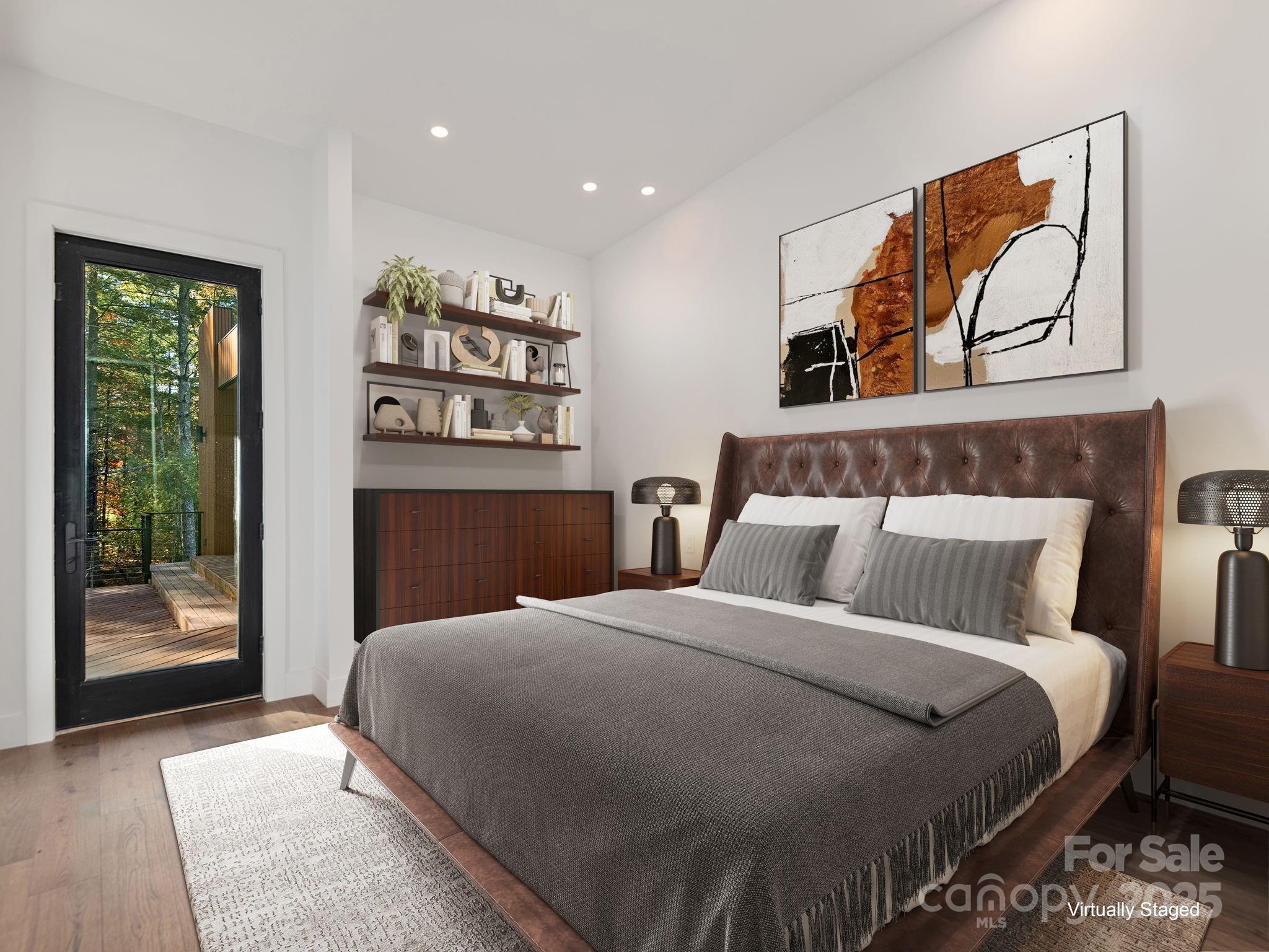 87 Verbania Rd Mills River Mills River, NC 28759 - Photo 11 of 27 a bedroom with a large bed and a painting on the wall