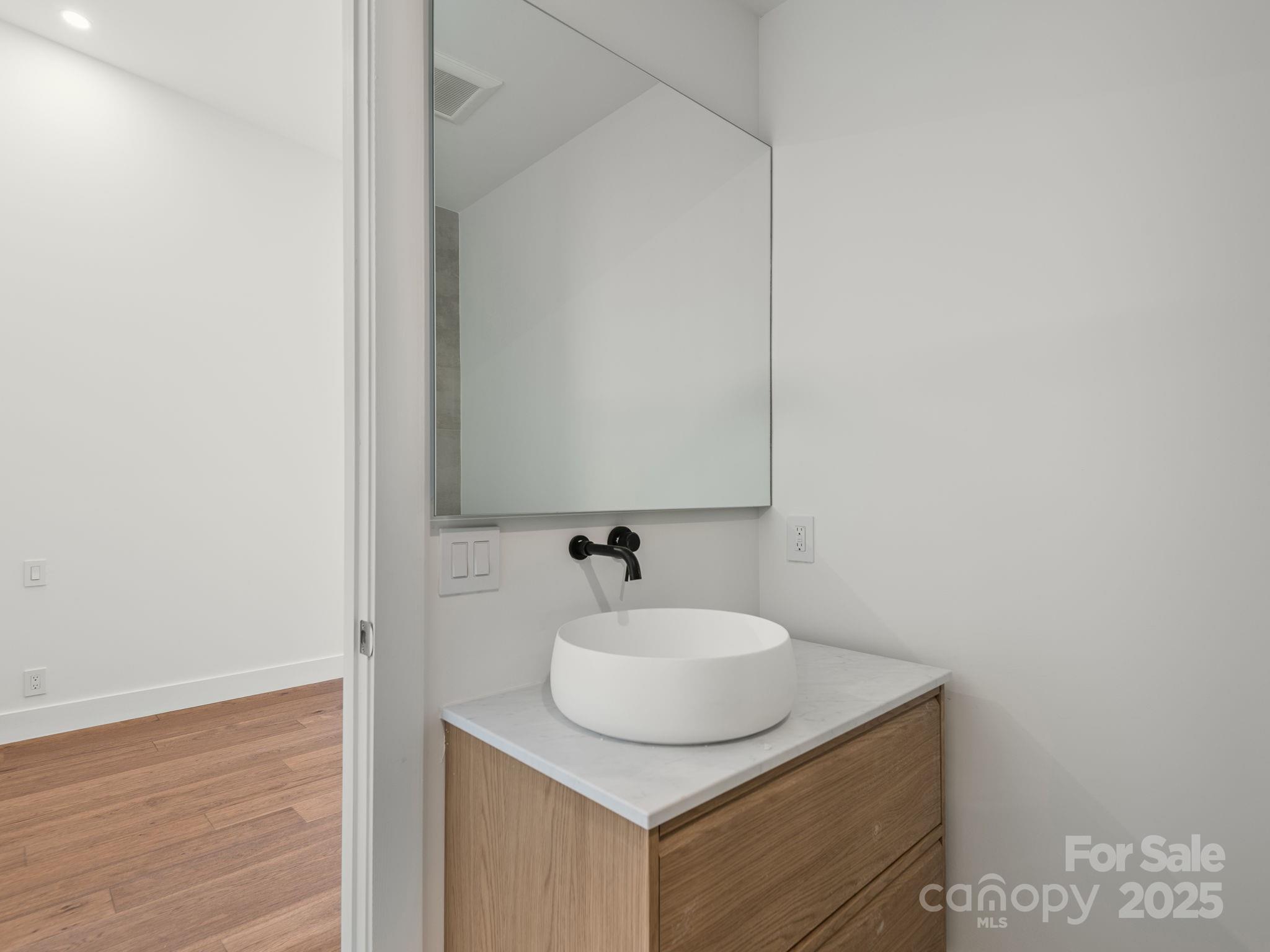 87 Verbania Rd Mills River Mills River, NC 28759 - Photo 17 of 27 a bathroom with a sink and a mirror