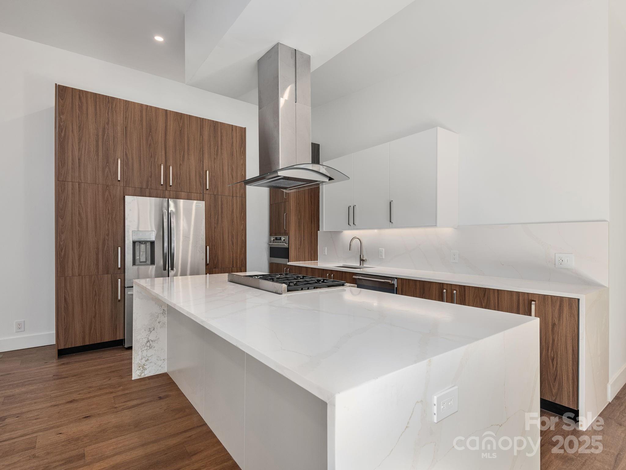 87 Verbania Rd Mills River Mills River, NC 28759 - Photo 6 of 27 a kitchen with kitchen island a counter top and a stove
