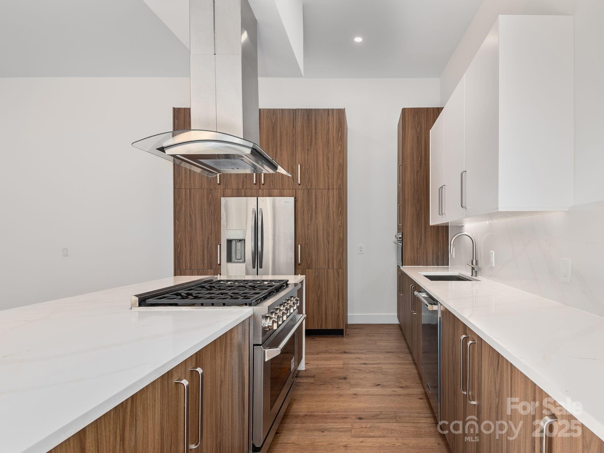 87 Verbania Rd Mills River Mills River, NC 28759 - Photo 7 of 27 a kitchen with a sink stove and cabinets