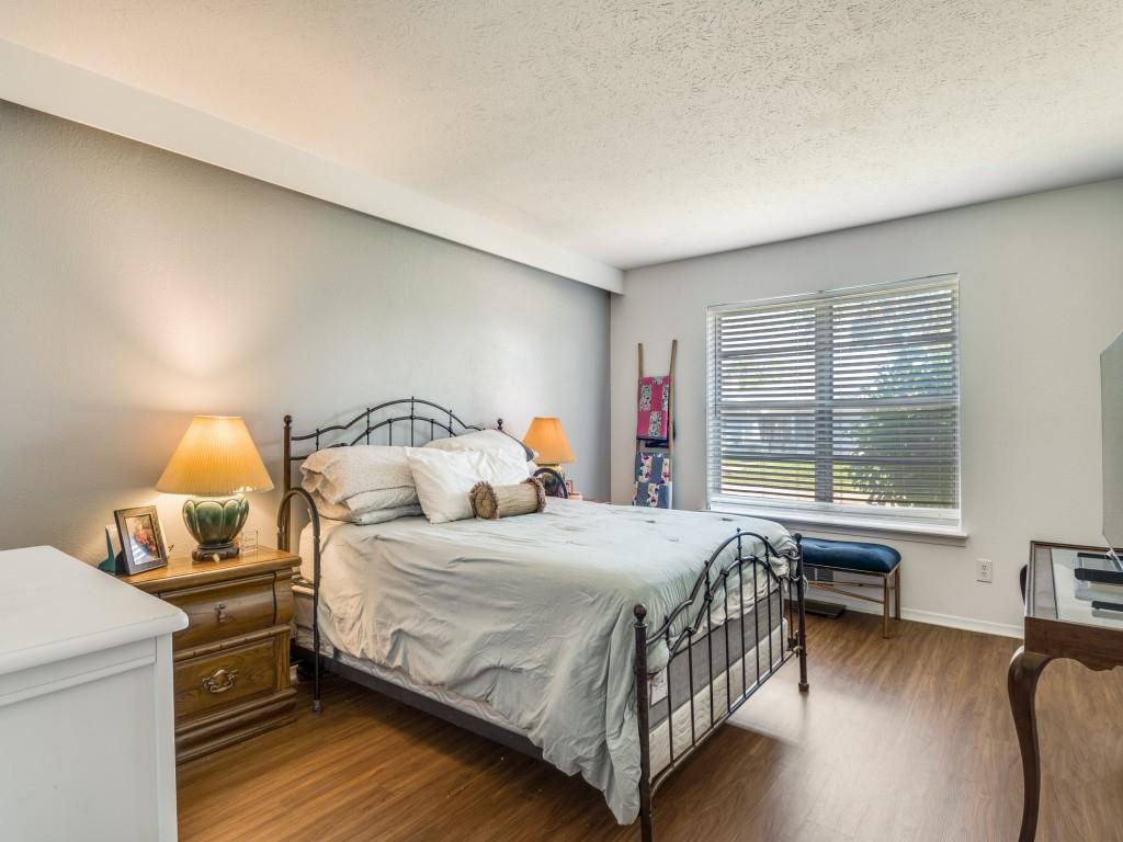 7415-7417 Walling Lane Dallas, TX 75231 - Photo 19 of 25 a bedroom with a bed and a window