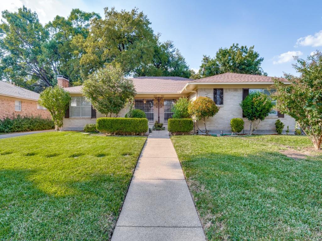 7415-7417 Walling Lane Dallas, TX 75231 - Photo 2 of 25 a front view of a house with yard and green space
