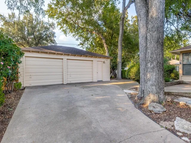 a view of a house with a tree