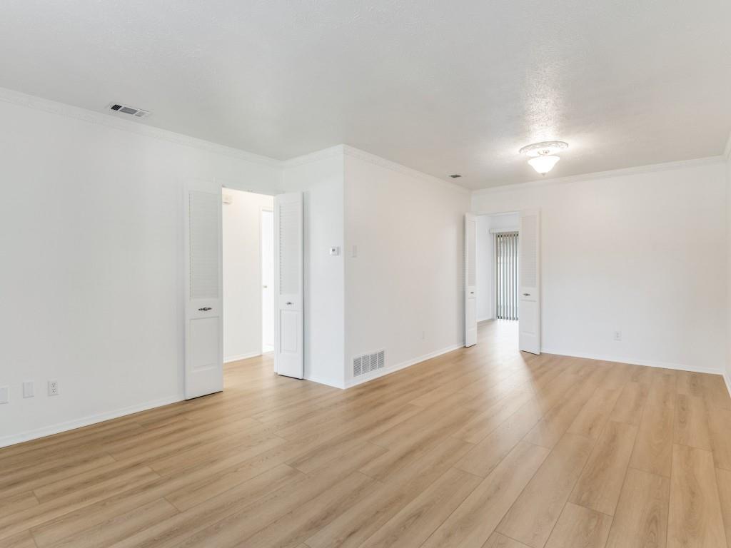 7415-7417 Walling Lane Dallas, TX 75231 - Photo 4 of 25 a view of an empty room with wooden floor