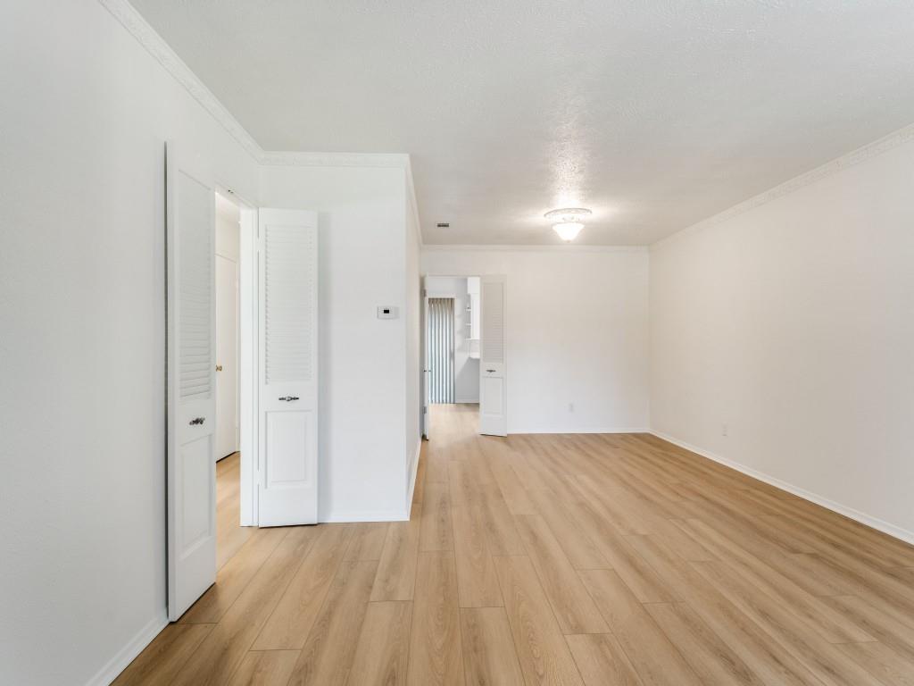 7415-7417 Walling Lane Dallas, TX 75231 - Photo 5 of 25 a view of an empty room and wooden floor