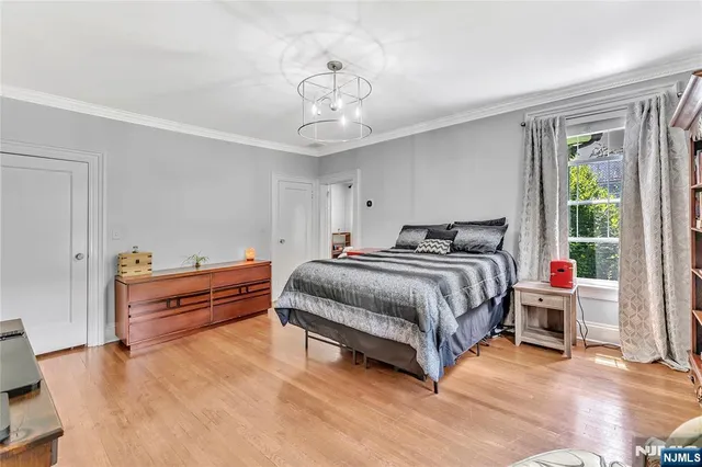 a bedroom with bed and window