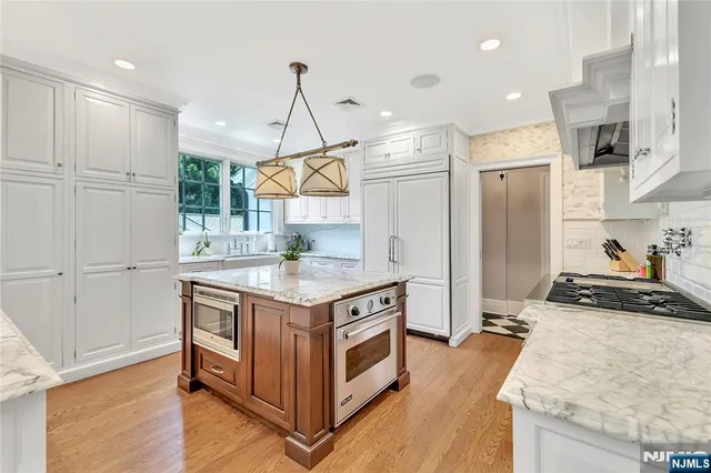 a kitchen with a stove and a sink