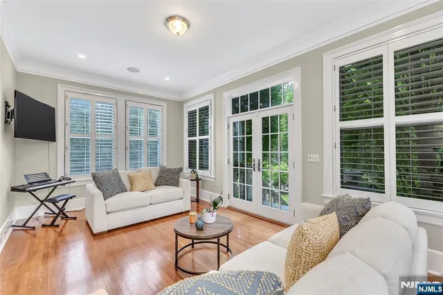 a bathroom with a granite countertop toilet and a sink
