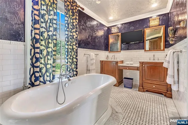 a bathroom with a bathtub and shower