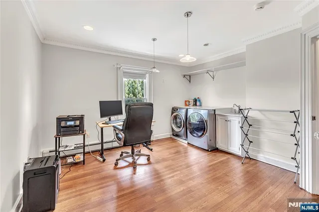 a view of workspace with wooden floor and windows