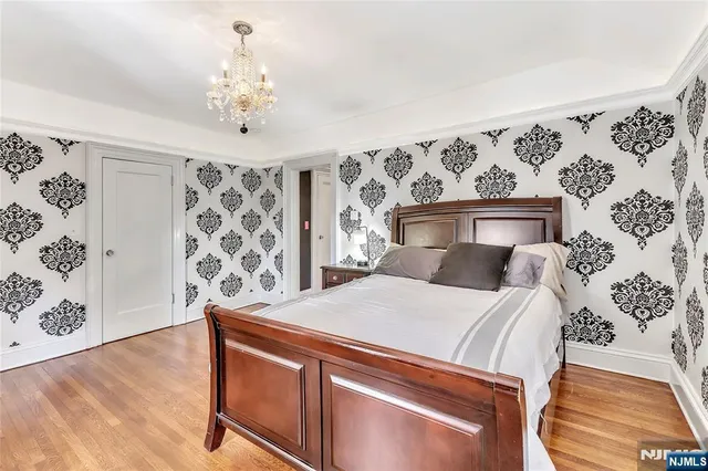 a bathroom with a granite countertop toilet sink and mirror