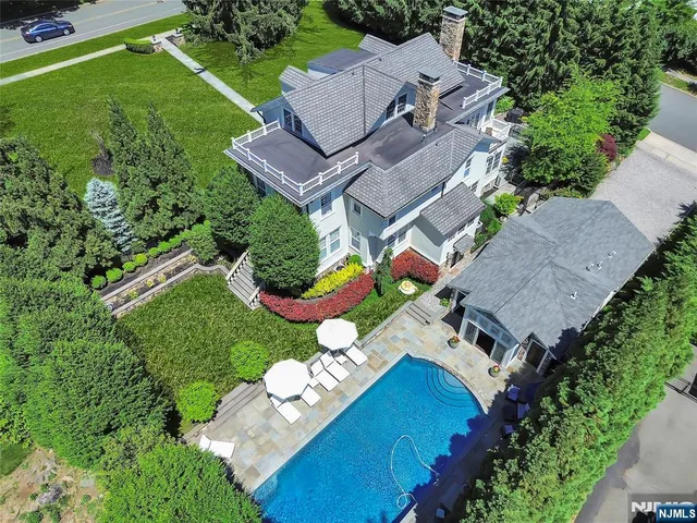 an aerial view of a house with a garden