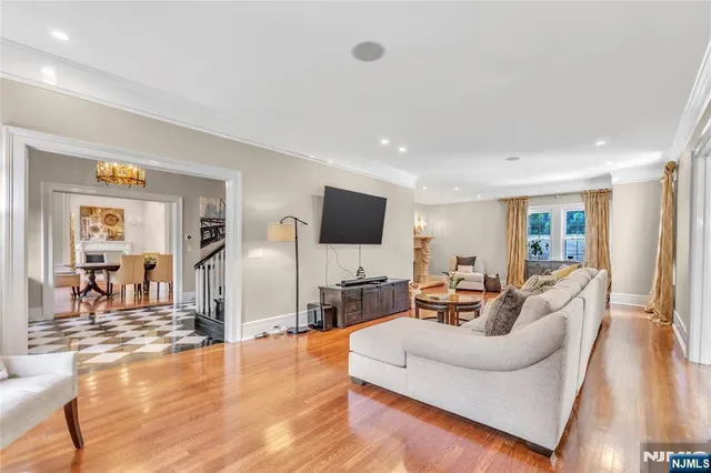 a living room with fireplace furniture and a flat screen tv