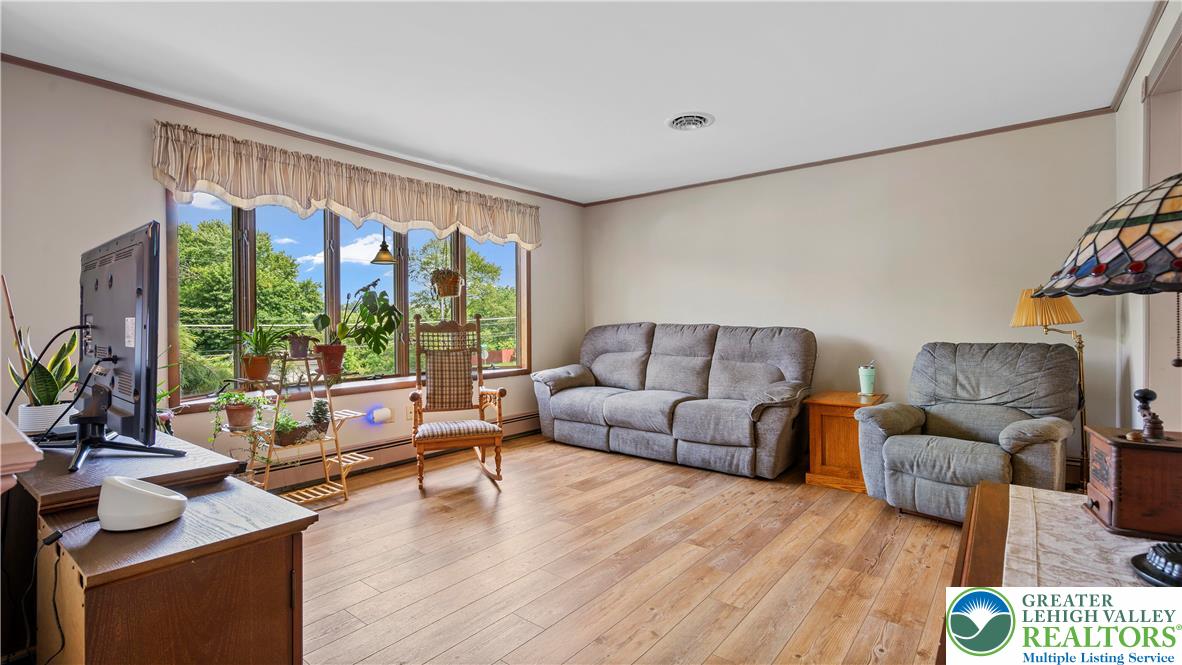 807 Bangor Road Nazareth, PA 18064 - Photo 16 of 46 a living room with furniture and a large window