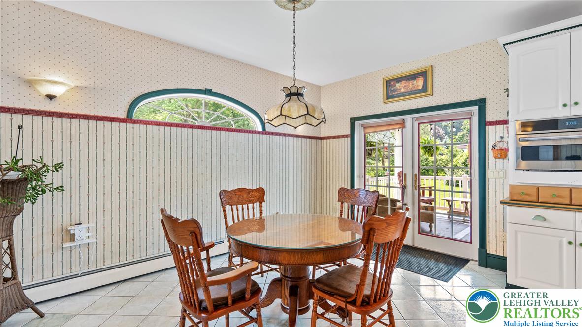 807 Bangor Road Nazareth, PA 18064 - Photo 20 of 46 a view of a dining room with furniture window and wooden floor