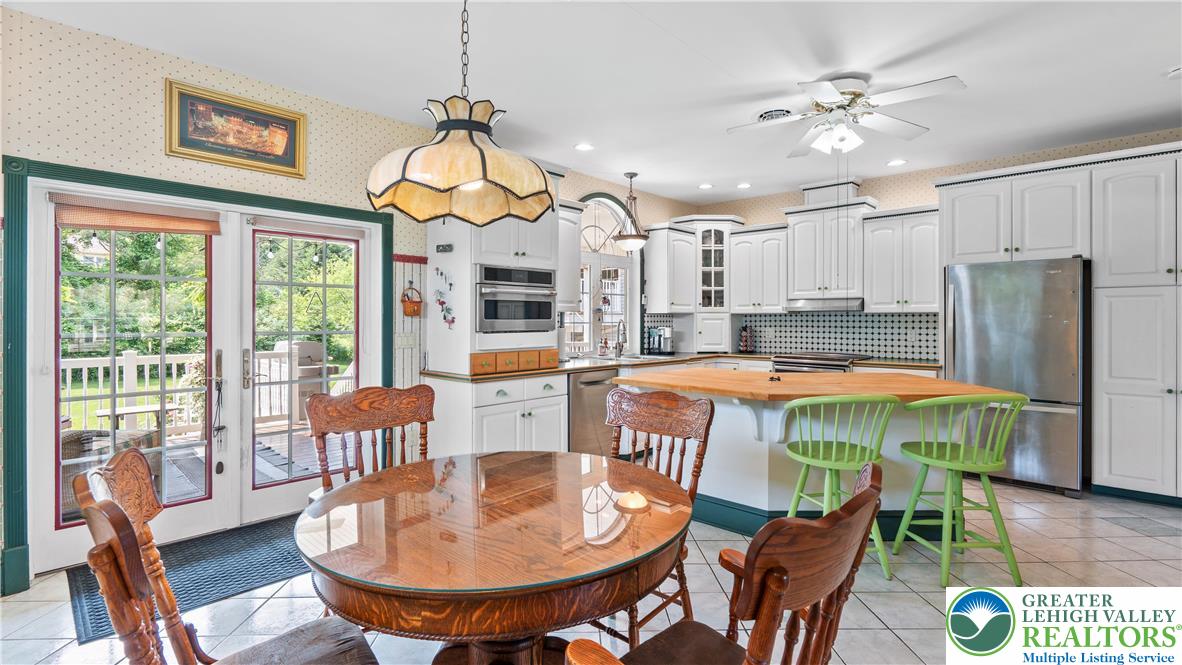 807 Bangor Road Nazareth, PA 18064 - Photo 21 of 46 a dining room with furniture a chandelier and wooden floor