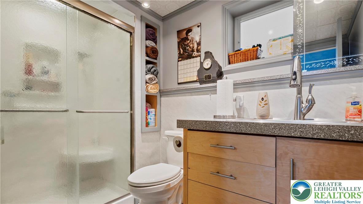 807 Bangor Road Nazareth, PA 18064 - Photo 37 of 46 a bathroom with a granite countertop sink a toilet and shower