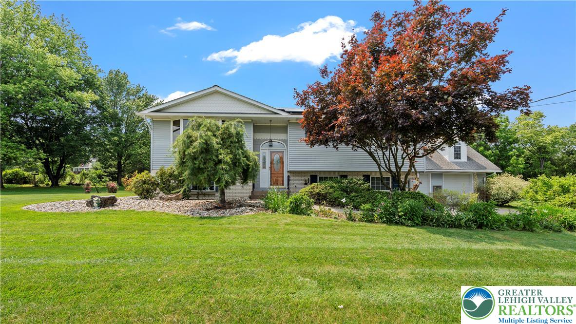 807 Bangor Road Nazareth, PA 18064 - Photo 45 of 46 a front view of a house with a yard and trees