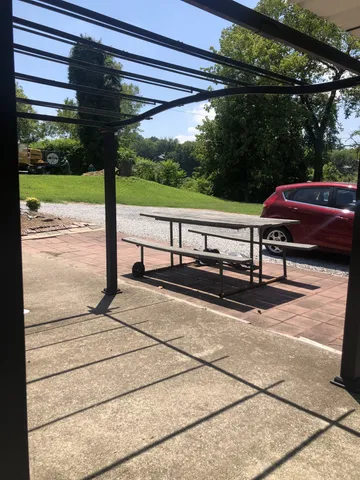 a view of backyard with sitting area
