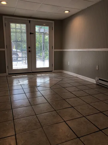 a view of a livingroom with a black and white checkered floor