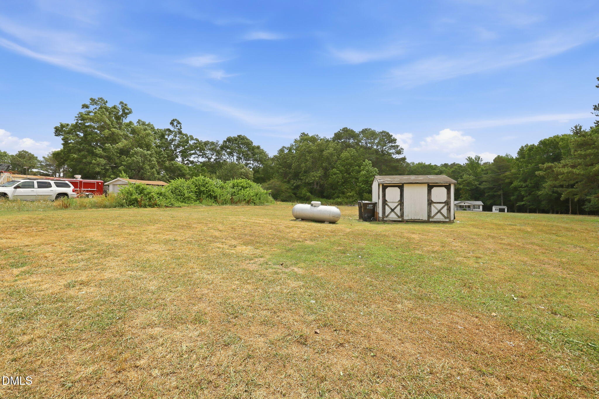 1758 Barber Mill Road Clayton, NC 27520 - Photo 29 of 41 a front view of a house with a yard and trees