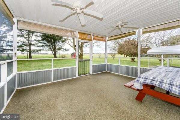a very nice looking room with a large window and bed