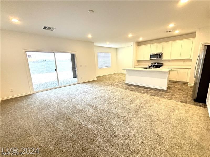 8336 Rowan Rdg Avenue Las Vegas, NV 89147 - Photo 2 of 15 This inviting space combines living and cooking with seamless outdoor access.