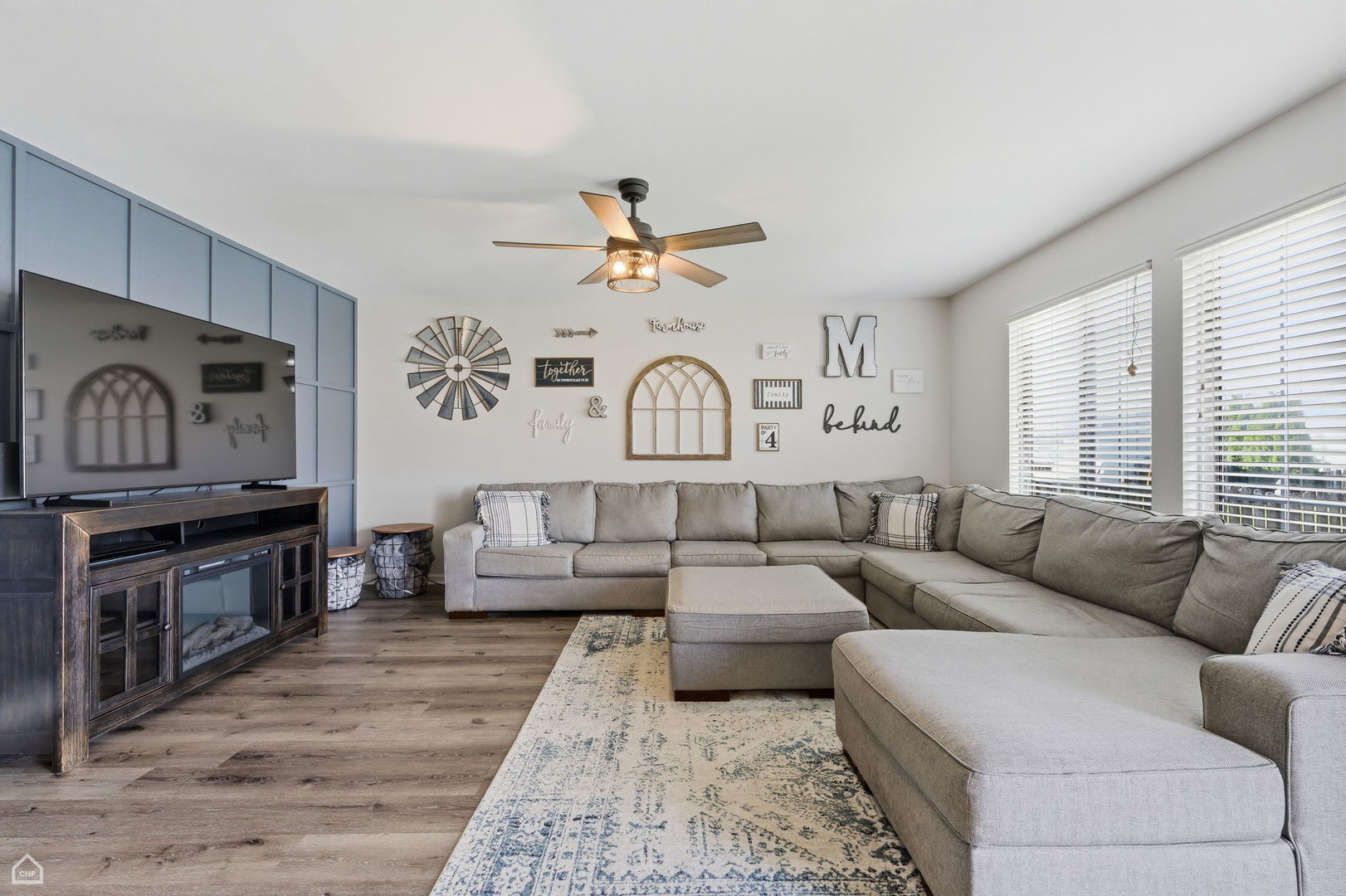 617 Brita Trail Minooka, IL 60447 - Photo 11 of 34 a living room with furniture ceiling fan and a rug