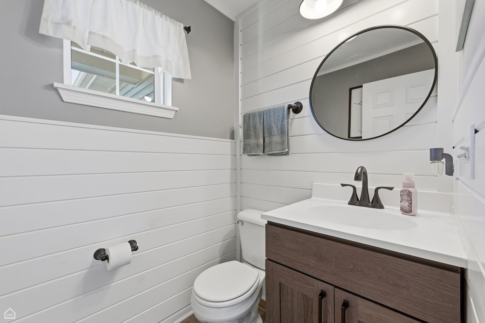 617 Brita Trail Minooka, IL 60447 - Photo 14 of 34 a bathroom with a sink a toilet and a mirror