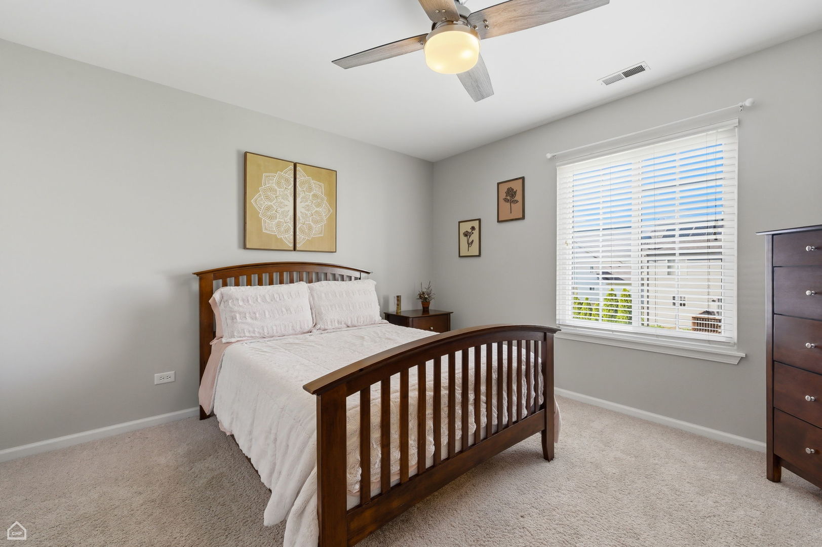 617 Brita Trail Minooka, IL 60447 - Photo 18 of 34 a bedroom with a bed and window