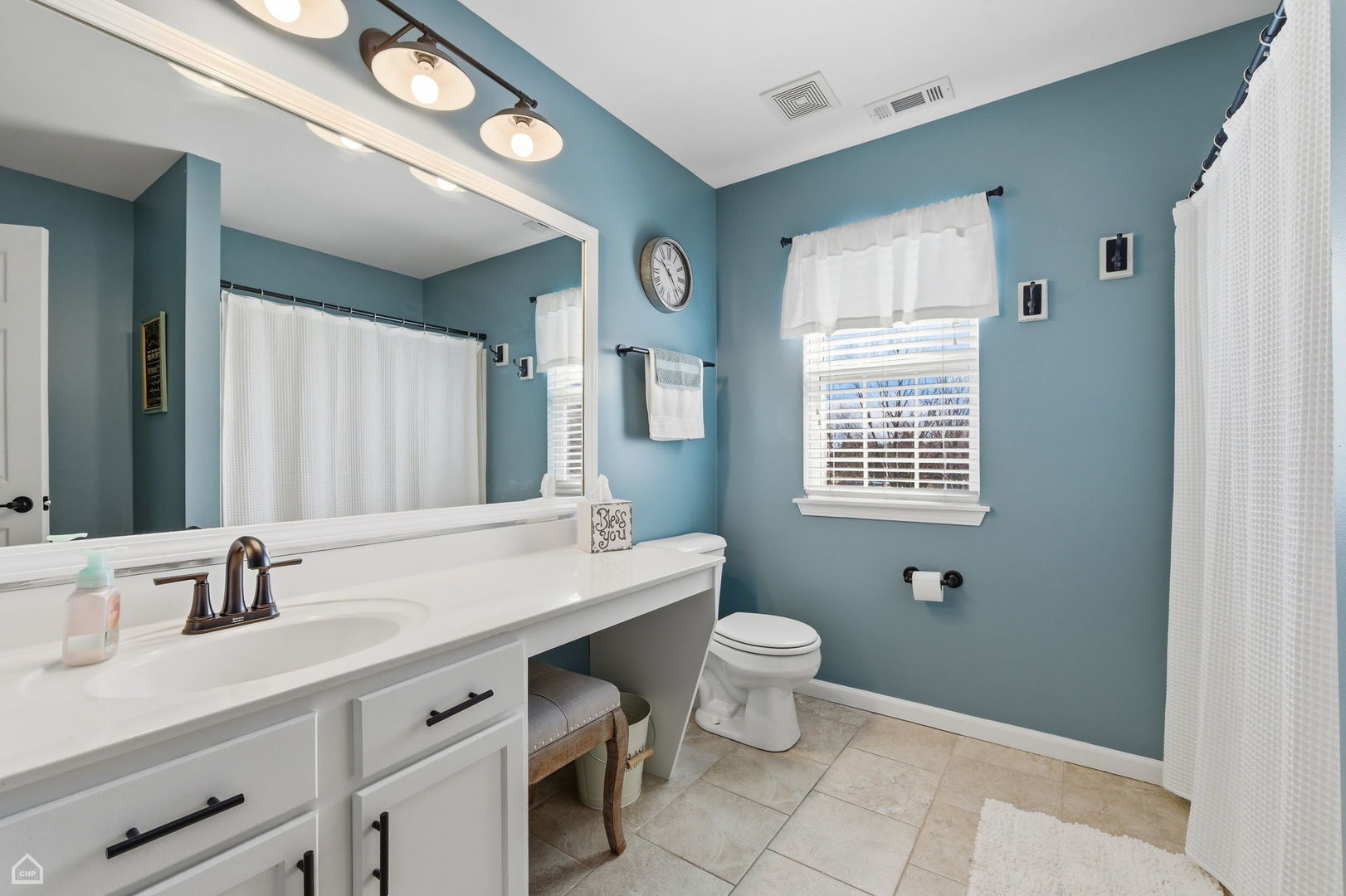617 Brita Trail Minooka, IL 60447 - Photo 22 of 34 a bathroom with a double vanity sink a toilet and a mirror