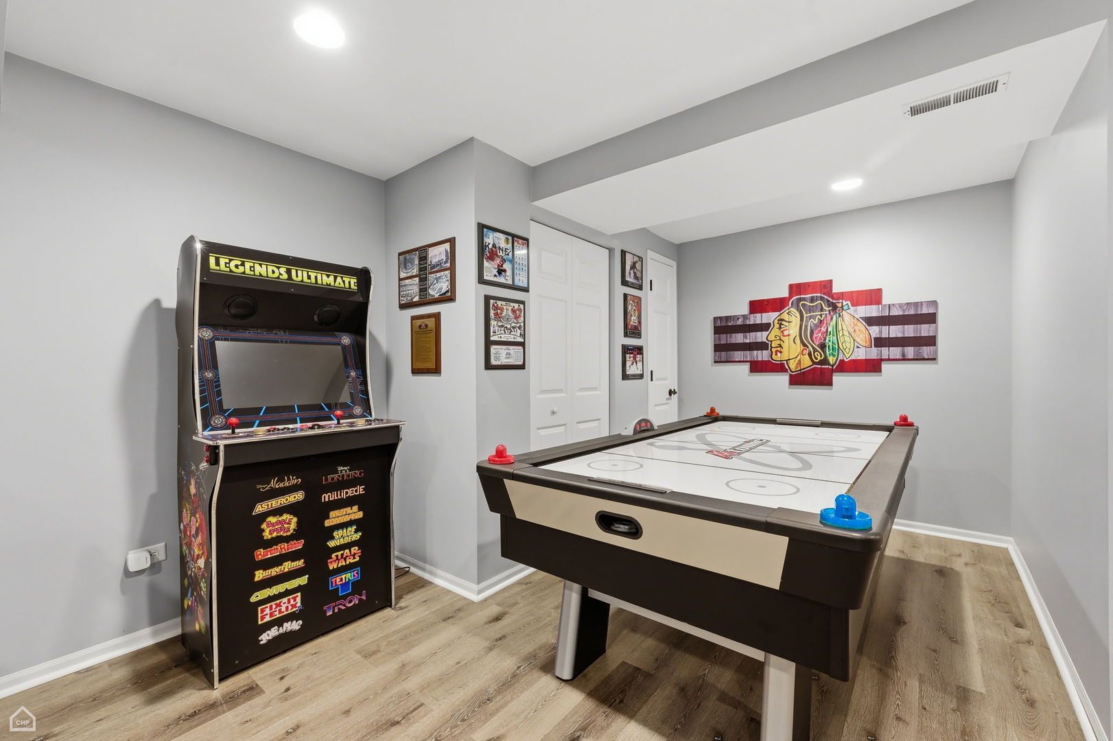 617 Brita Trail Minooka, IL 60447 - Photo 26 of 34 a living room with furniture a flat screen tv and a table