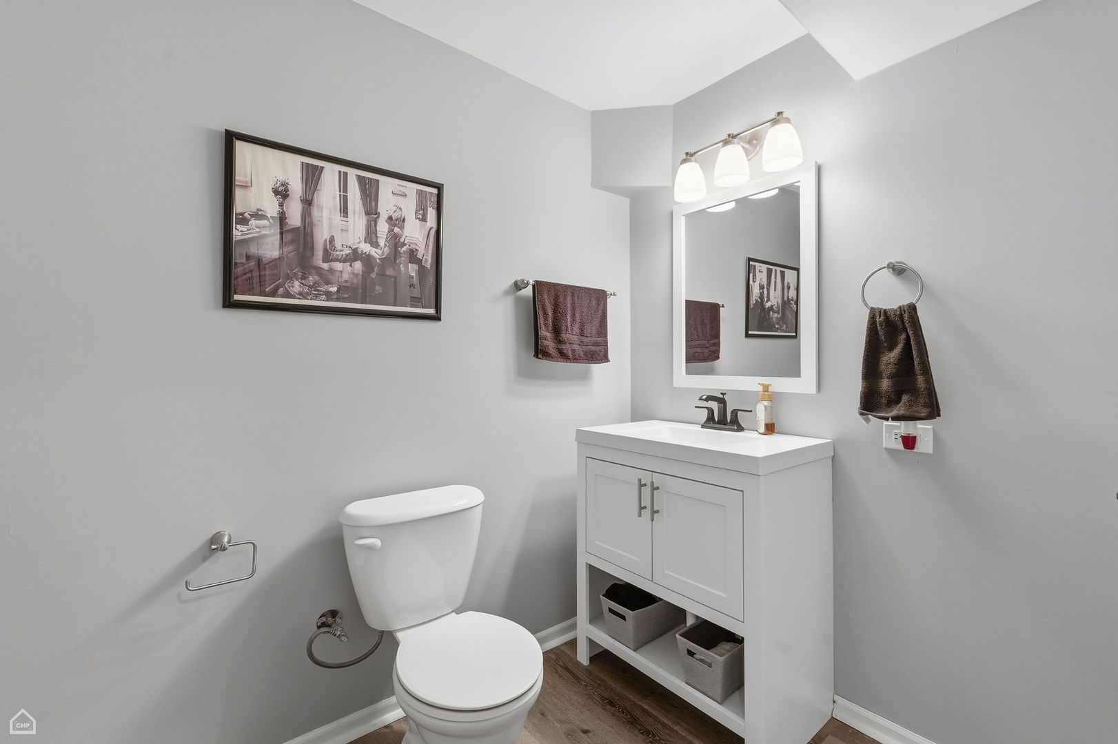 617 Brita Trail Minooka, IL 60447 - Photo 27 of 34 a bathroom with a toilet a sink a mirror and vanity
