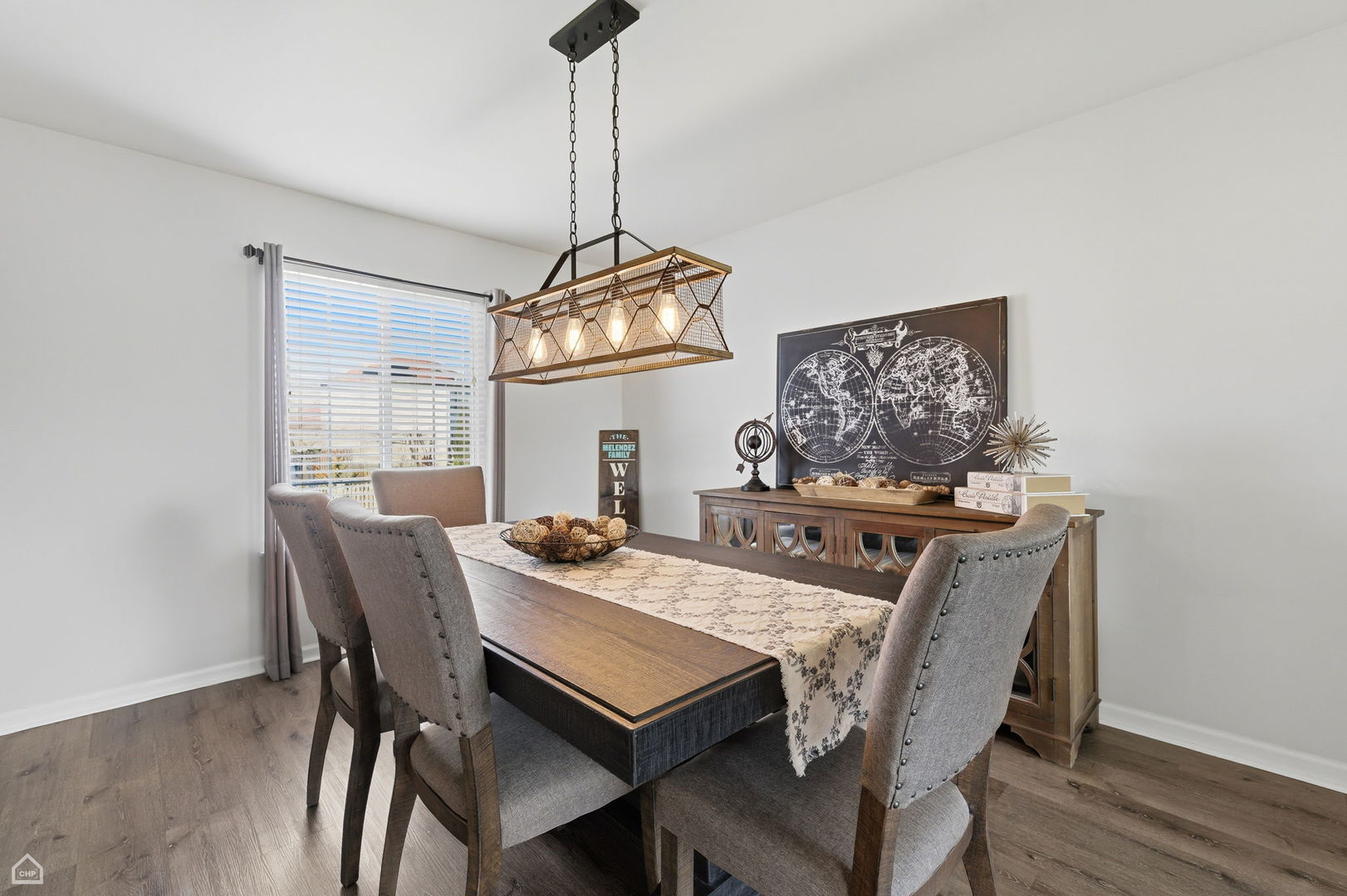 617 Brita Trail Minooka, IL 60447 - Photo 6 of 34 a view of a dining room with furniture window and wooden floor
