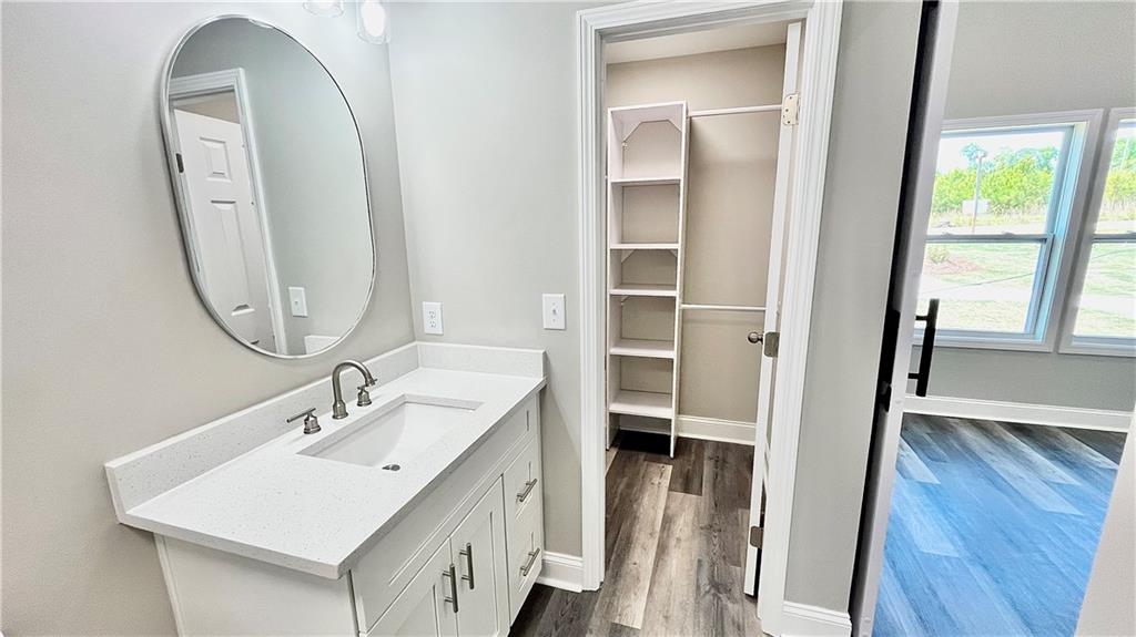 5 Green Road Griffin, GA 30224 - Photo 22 of 34 a bathroom with a sink a toilet and a mirror
