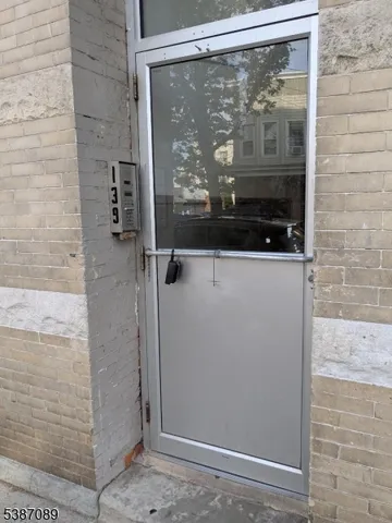 a bathroom with a glass shower door