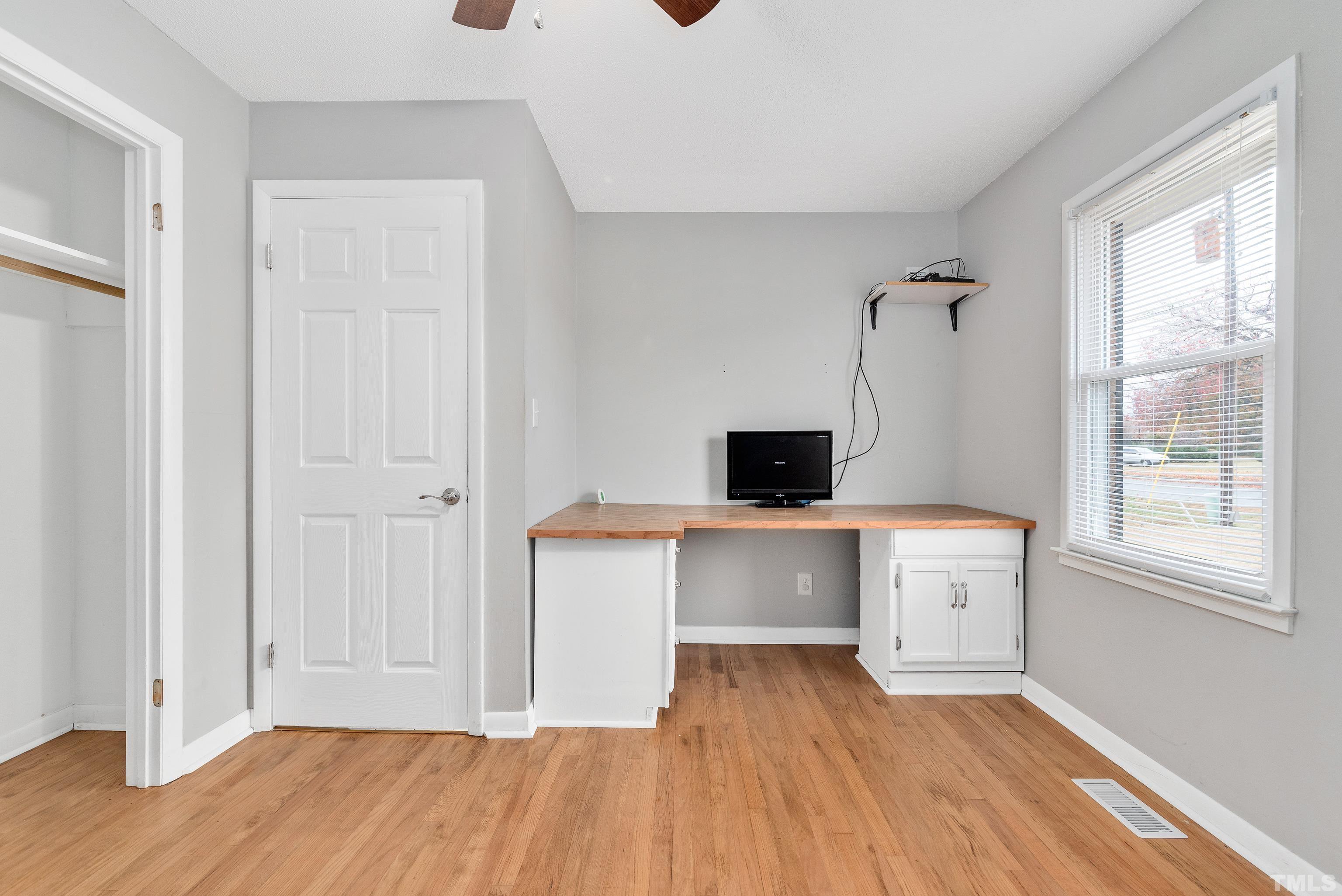 201 West B Street Erwin, NC 28339 - Photo 21 of 25 a view of a room with a hardwood and a window