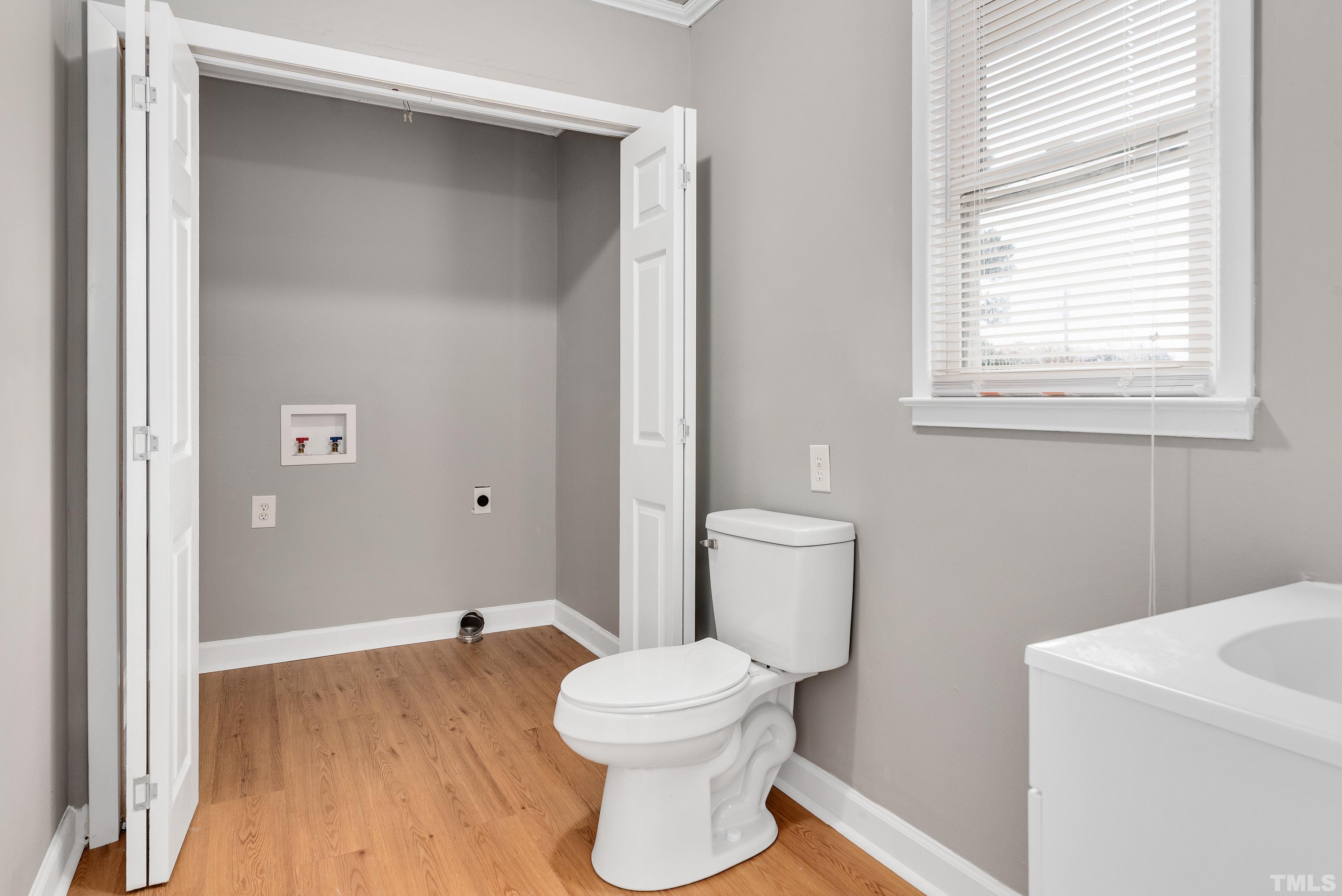 201 West B Street Erwin, NC 28339 - Photo 23 of 25 a bathroom with a sink and a toilet