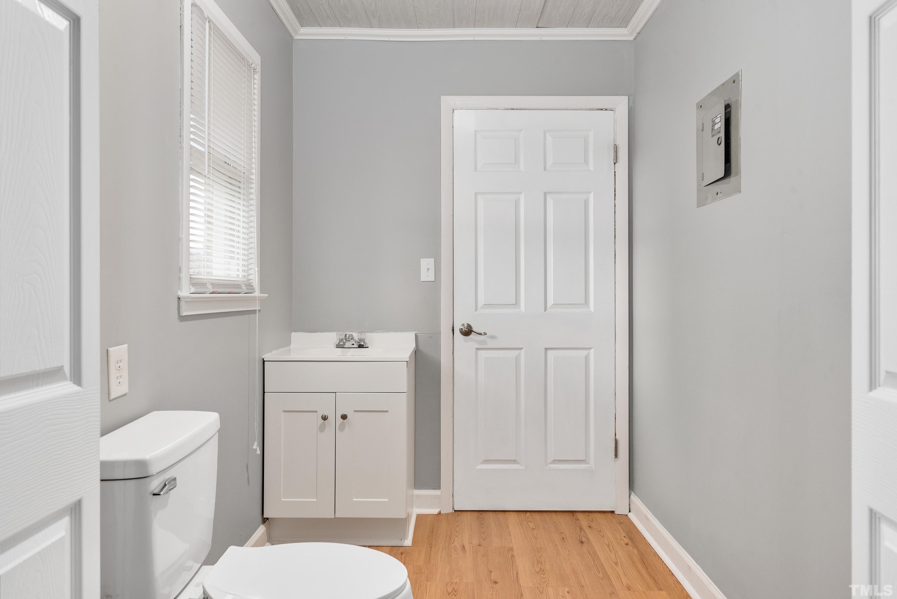 201 West B Street Erwin, NC 28339 - Photo 24 of 25 a bathroom with a sink a toilet and vanity